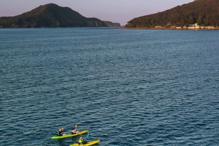 a small boat in a large body of water