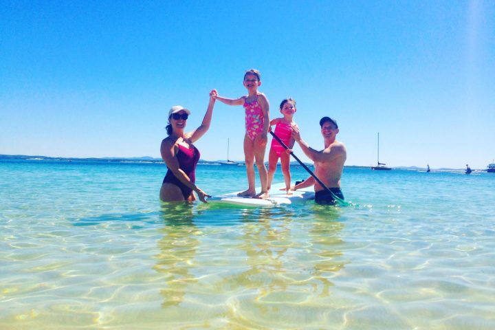 a group of people swimming in a body of water