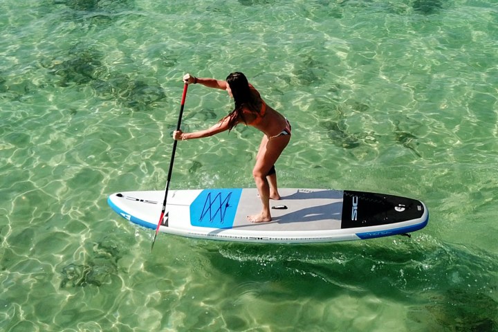 a man riding a wave on a surfboard in the ocean