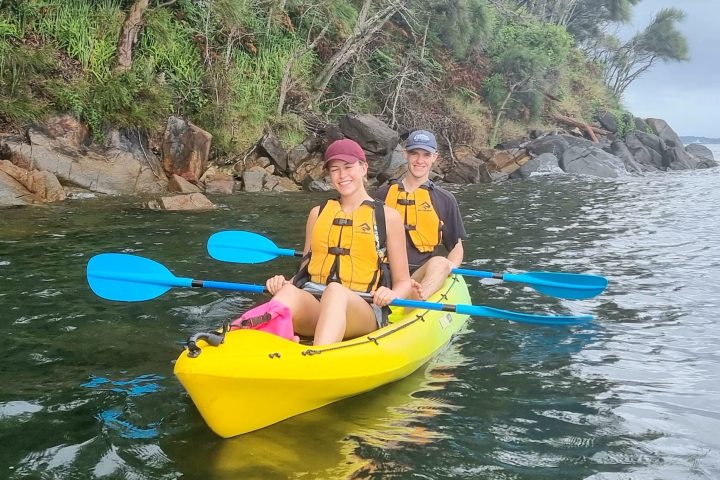 a person riding on the back of a boat in the water