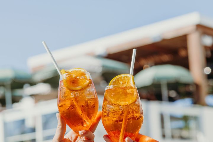 a hand holding an ice cream cone
